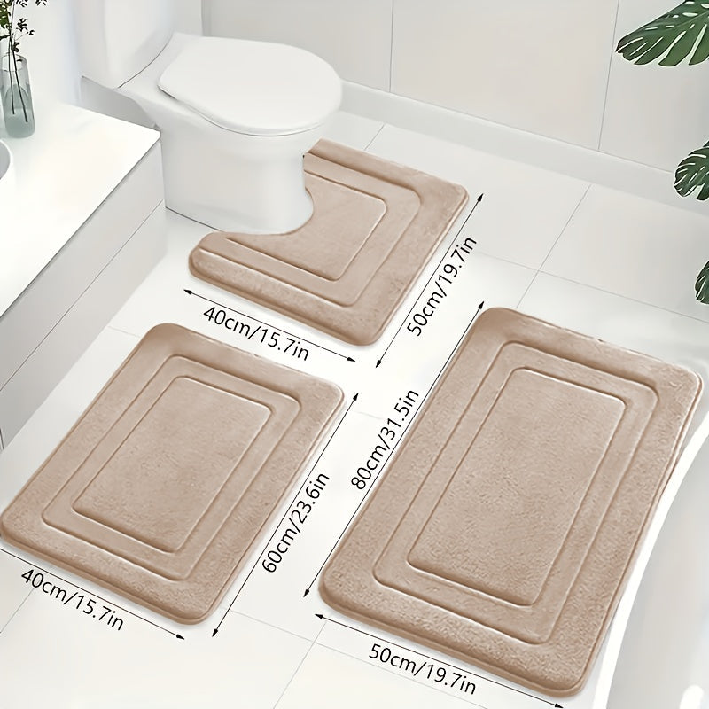 Sklisikker toalettmatte i grå memory foam, del av 3-delt baderomsmattesett. Komfortabel og praktisk.