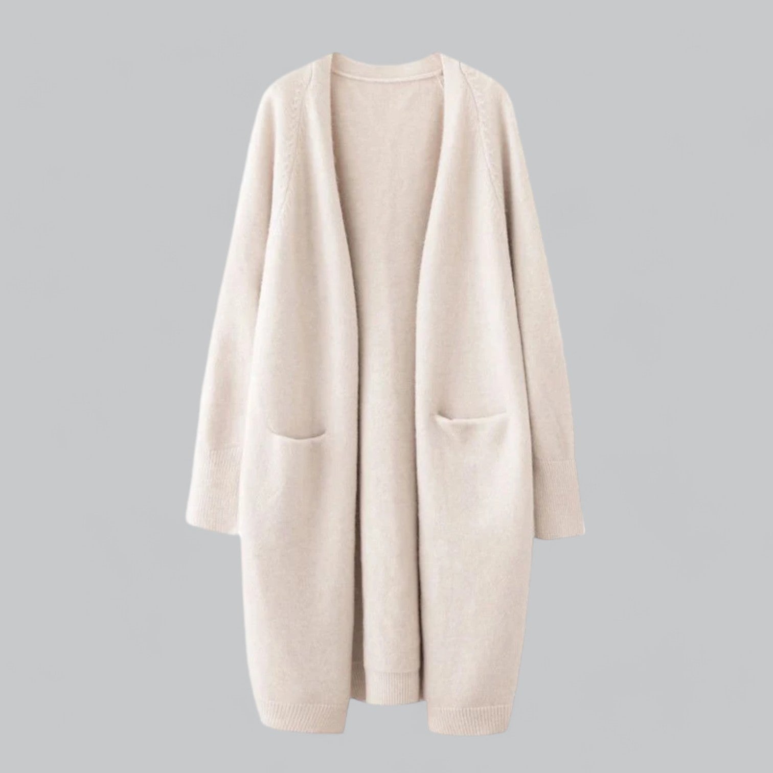 Cashmere Strickjacke Damen aus weichem Material in Beige, klassisches Design, lang und elegant, warm für vielseitige Anlässe.