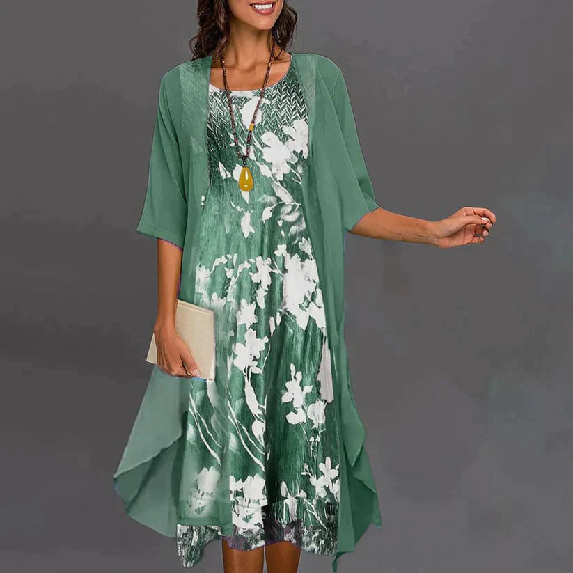 Elegantes Frauenkleid mit Blumenmuster, großzügiger Saum, figurbetonte Silhouette, zeitlose Eleganz für jede Gelegenheit.