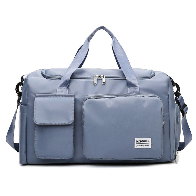 "Lila wasserdichte Reisetasche aus Oxford-Stoff, multifunktional, mit mehreren Fächern für Sport und Reisen."