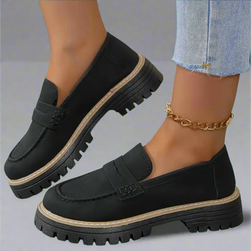 "Luxuriöse Damen Loafer in Dunkelblau, zeitloses Design, hochwertige Materialien, ideal für Büro oder Alltag."