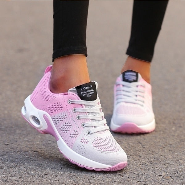 Orthopädische Turnschuhe, grau mit weißer Sohle, bieten ergonomische Passform und maximale Unterstützung für Damen.