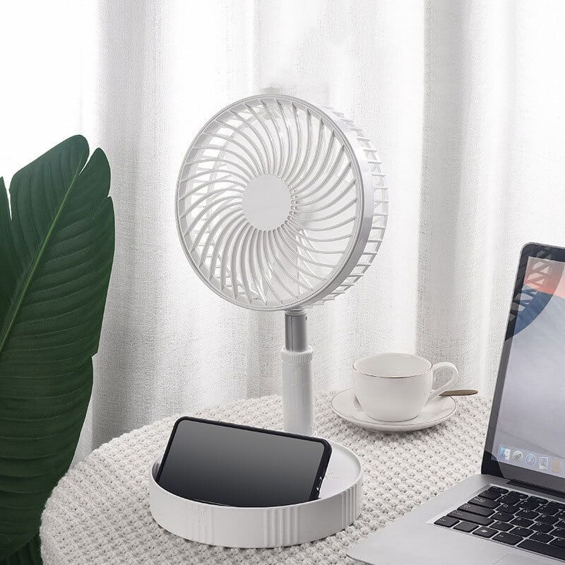 Hvit, sammenleggbar kjølevifte som kan brukes som bordvifte eller gulvvifte. Ideell for reise og hjem.