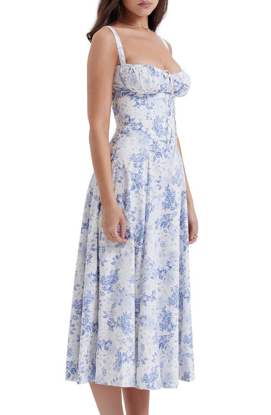 Livformende sommerkjole, blomstrete og pustende, en elegant damekjole i midi-lengde.