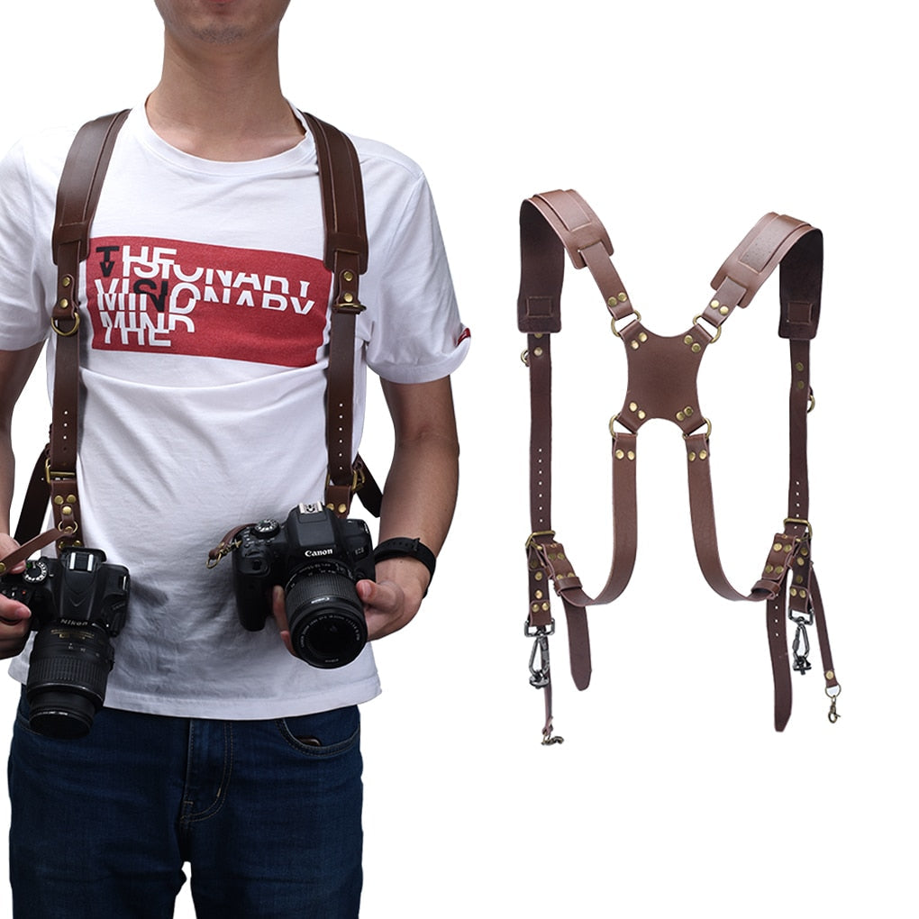 Brun dobbel skulderrem i skinn for digitalkameraer. Gir hender fri og komfort for profesjonelle fotografer.