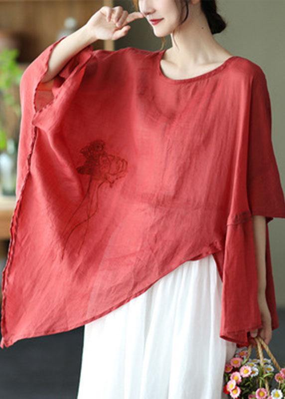Unik dame skjorte med asymmetrisk design og elegante broderier, ideell som festtopp eller fritidsplagg.
