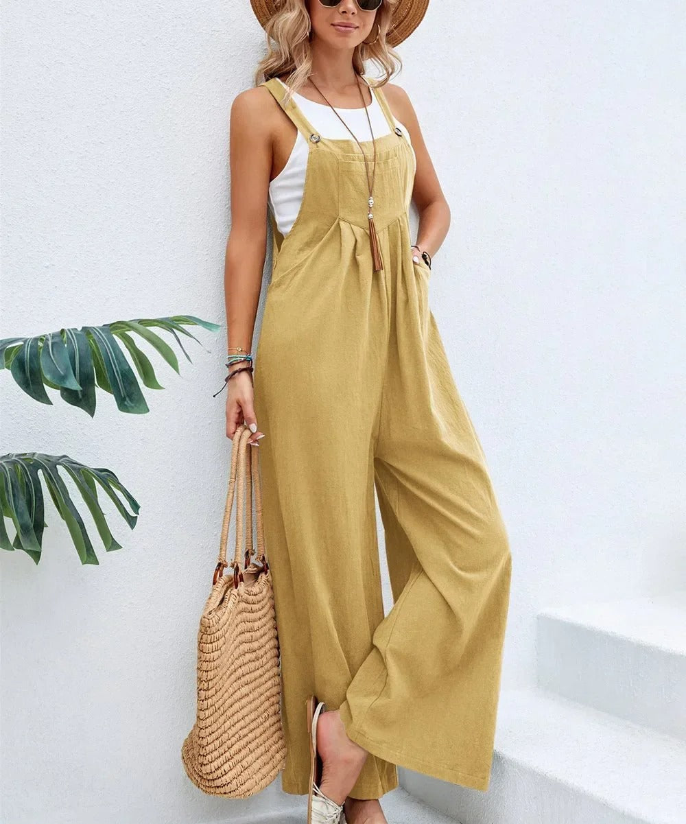 Stilren dame jumpsuit med bib-detaljer og brede ben. Baggy passform for en komfortabel, uformell look.