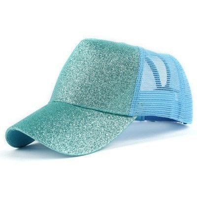 Trendy damecaps for rotete bolle, essensiell for en avslappet og chic look.
