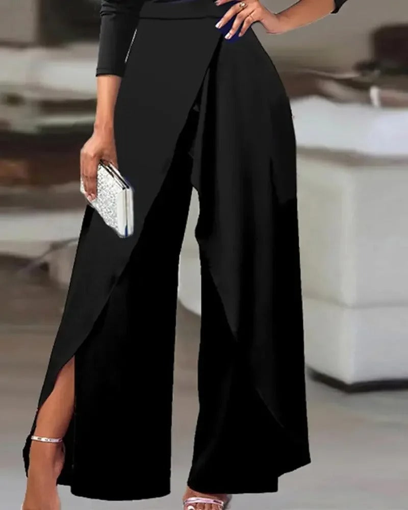 Komfortabel dame jumpsuit med vide ben, splitt og kald skulder. Elegant antrekk for enhver anledning.
