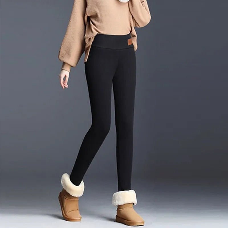 Grå, sømløse dame leggings med høy midje, designet for vinter. Komfortable og stilige kvinneklær.