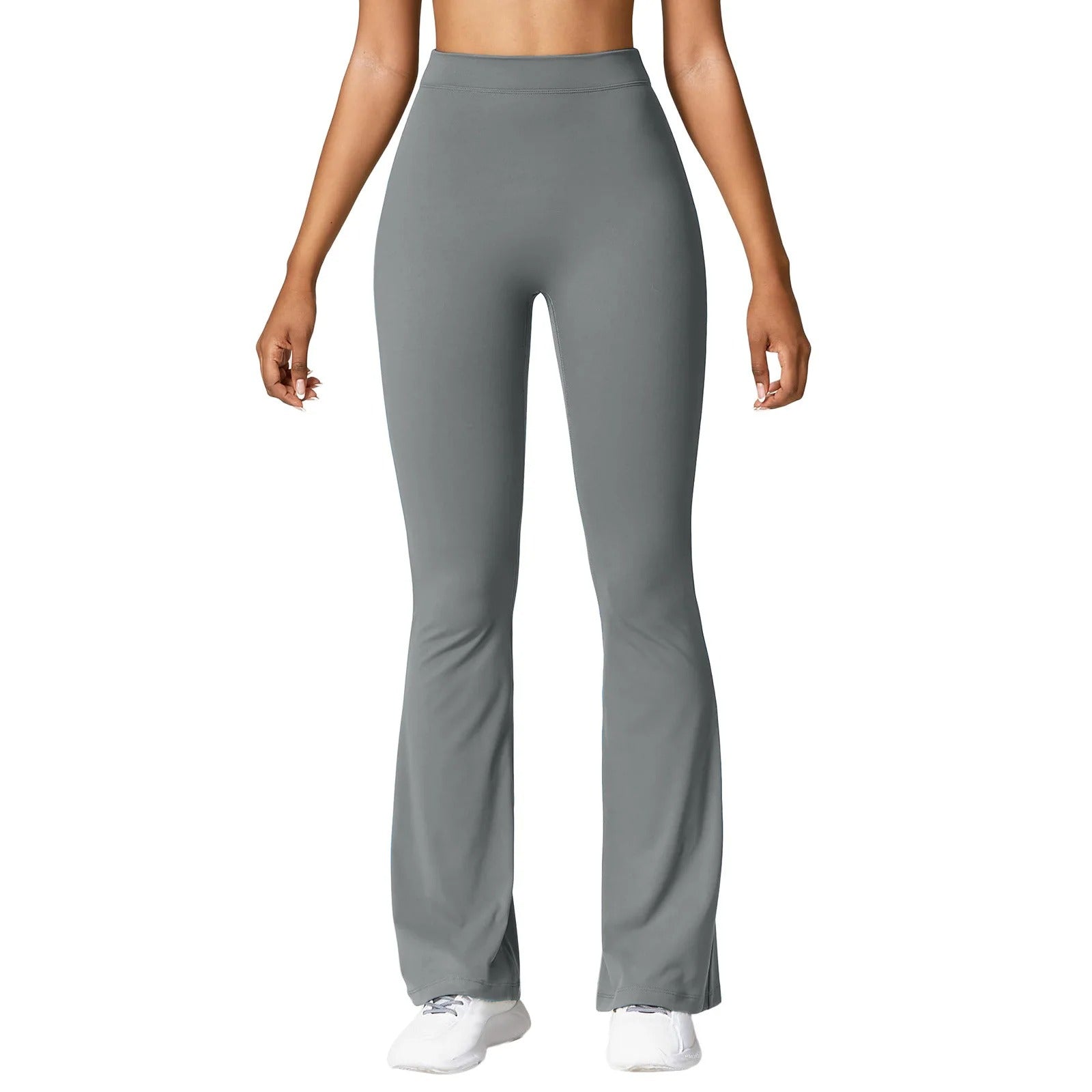 Modell iført dame leggings med høy midje V-rygg, demonstrerer fleksibilitet og stil for aktivitet.
