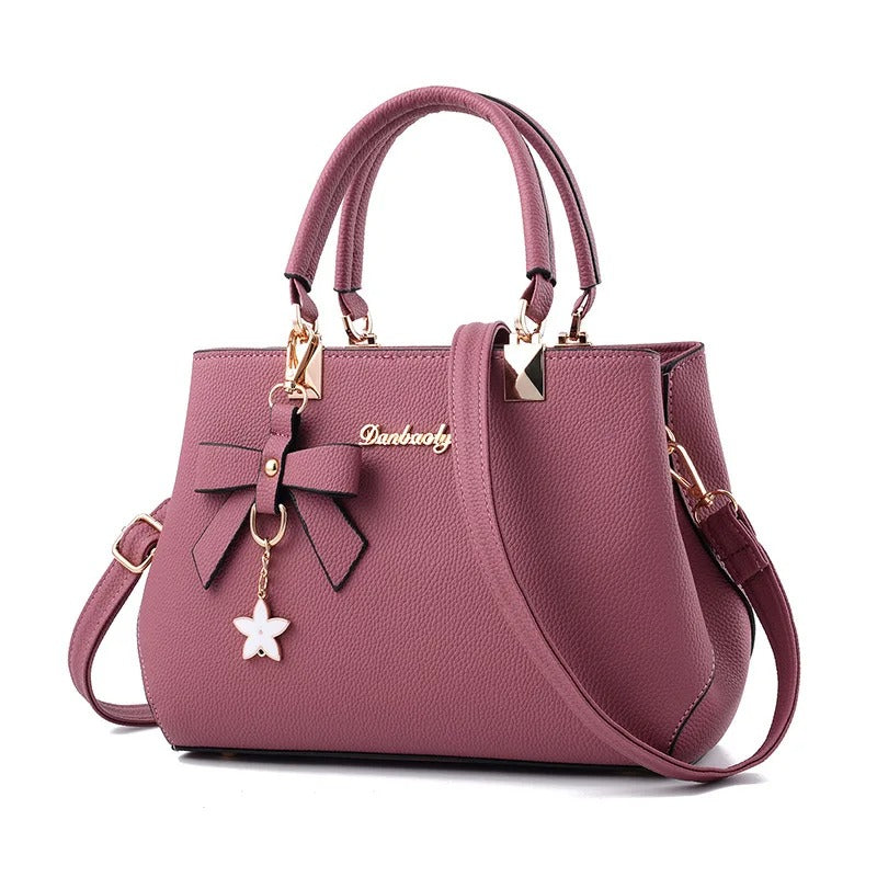 Kvinners elegante veske med blomstermønster, en allsidig crossbody og skulderveske.