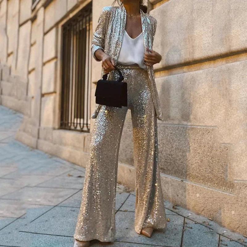 Nytt dame paljett sett bestående av en skimrende topp og en elegant høy liv bukse for festbruk.