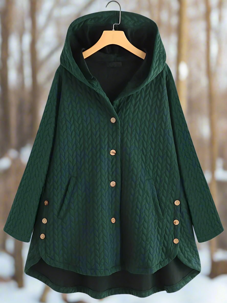 Elegant hettejakke for dame, med quiltet mønster og asymmetrisk snitt. Komfortabel og varm høstjakke.
