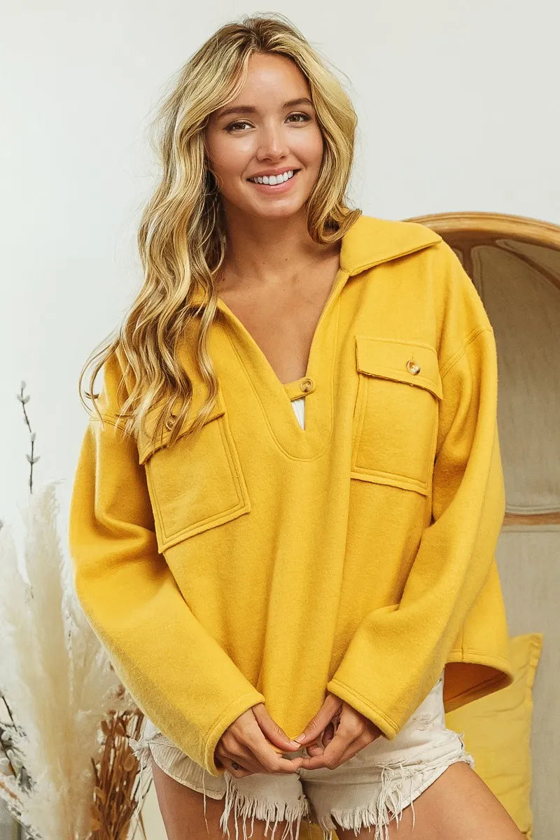 Varm og chic damegenser med elegant krage og praktiske lommer. Ideell for casual mote og komfort.