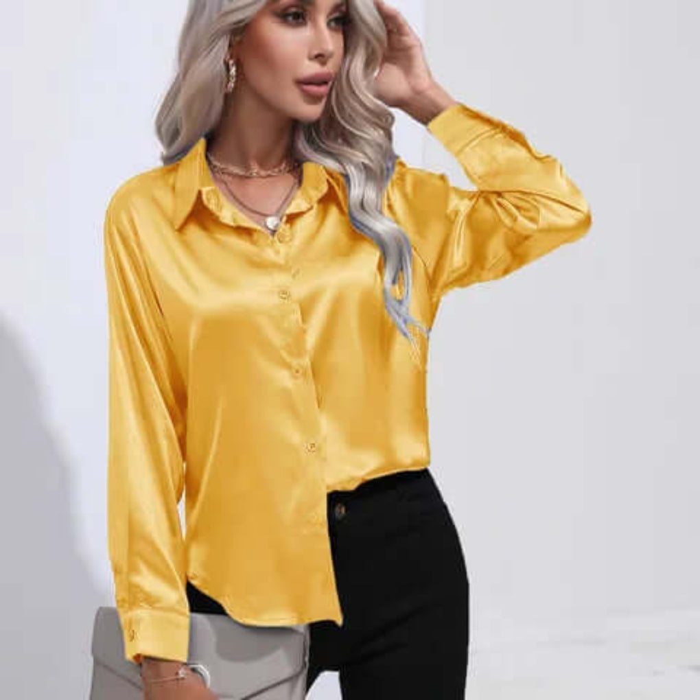Elegant langermet damebluse med løs passform. Perfekt for kontor og festlige anledninger.