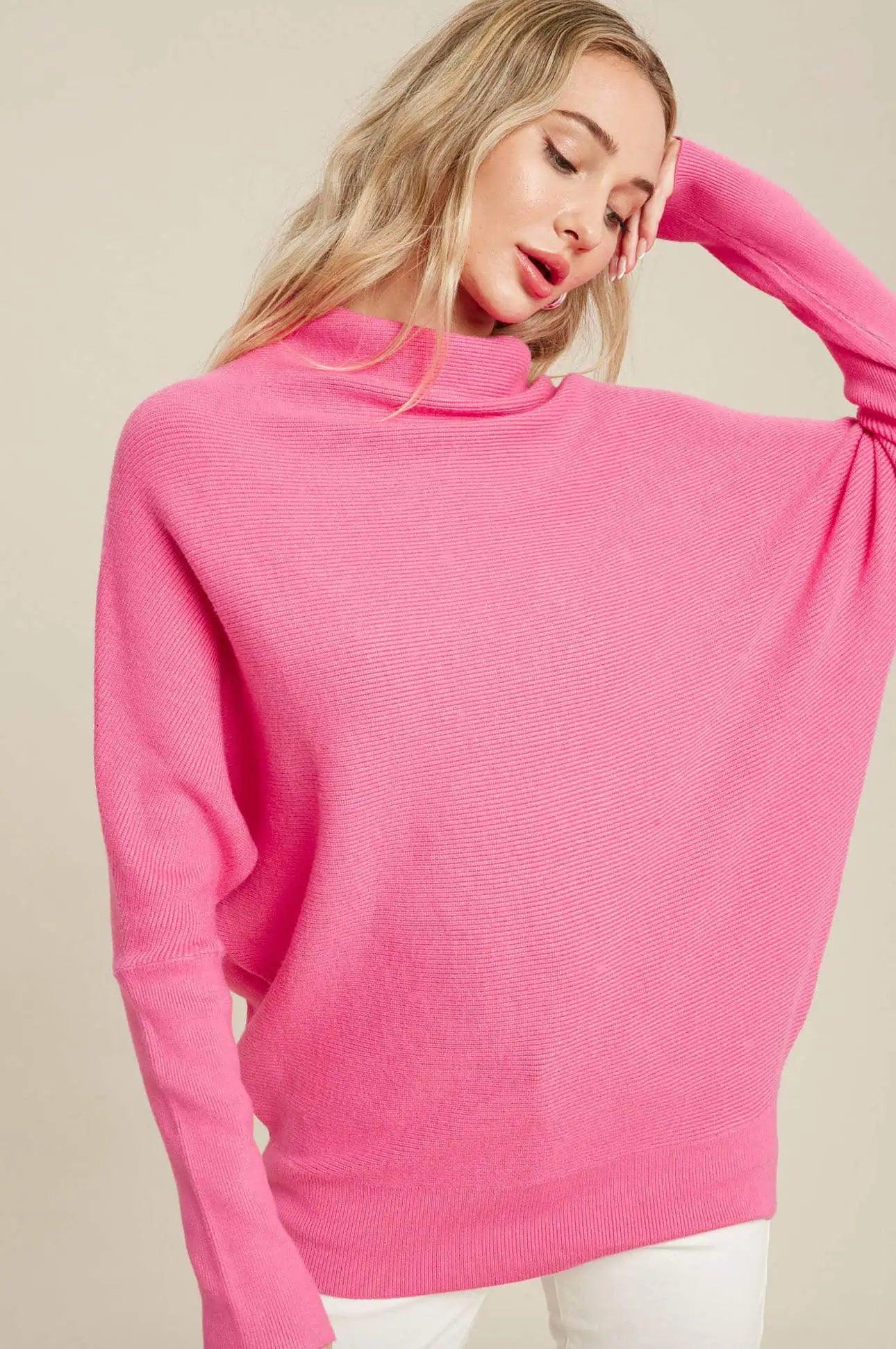 Komfortabel damegenser med oversized passform, slouchhals og dolmanermer, perfekt for vinteren.