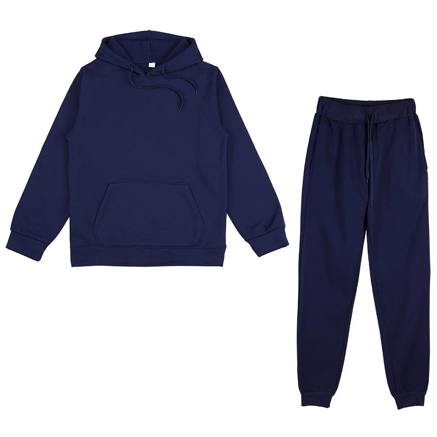 Vollansicht eines grauen Damen Trainingsanzugs mit Kapuzenpullover und Hose