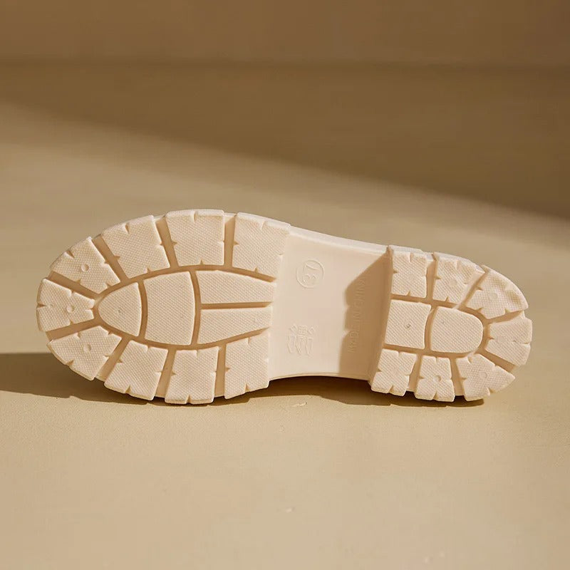 Dunkle, wasserdichte Damen-Chelsea-Stiefel, knöchelhoch, passend für Regenwetter und urbanen Stil.