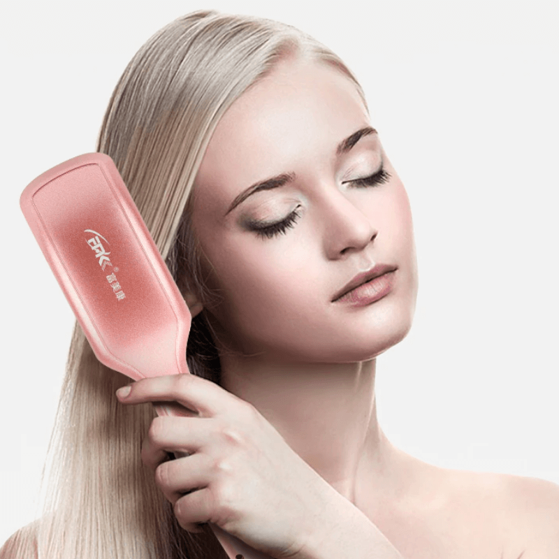 Kompakt og reisevennlig rettebørste i rosa/svart design. Perfekt for glatt hår på farten.