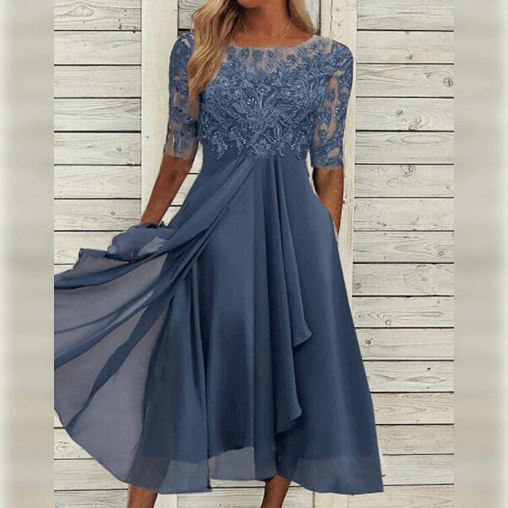 Kvinners asymmetrisk maxi kjole med luftig stoff og trekvart ermer, ideell for elegant stil.