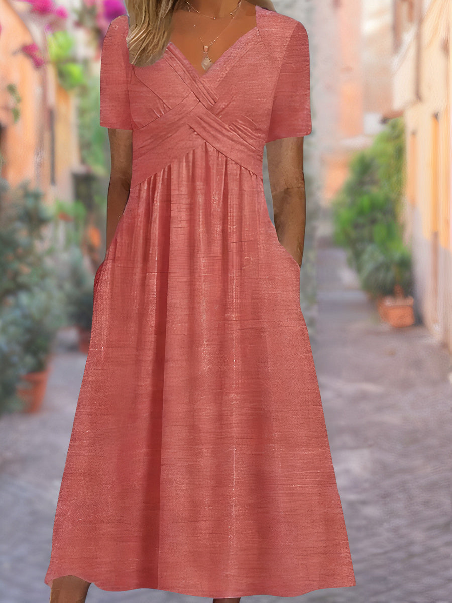 Stilfull hverdagskjole for dame. Elegant sommerkjole med V-hals og komfortabelt snitt, perfekt for sommeren.