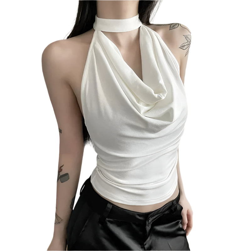 Fasjonabel halterneck topp i ensfarget design, perfekt for sommerdager eller under en blazer. Stilren dame topp.
