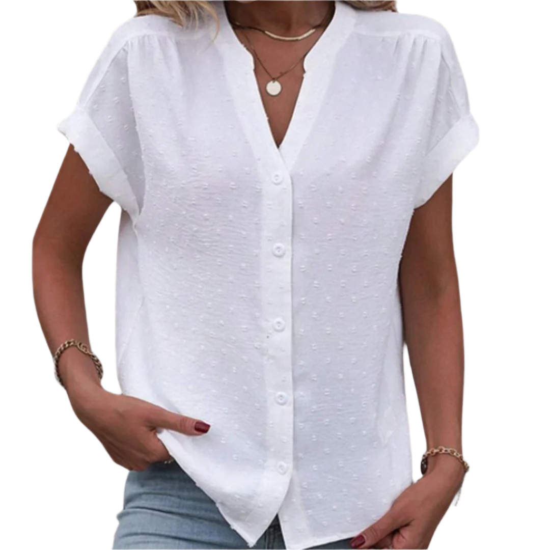 Elegant hvit kvinnebluse med klassiske knappedetaljer, perfekt for både hverdagsbruk og formelle anledninger.