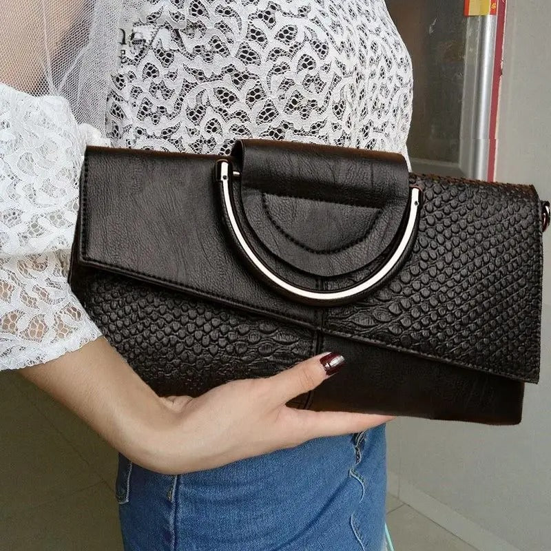 Elegant og funksjonell damerveske i mykt PU-lær; en romslig skulderveske for essentials.
