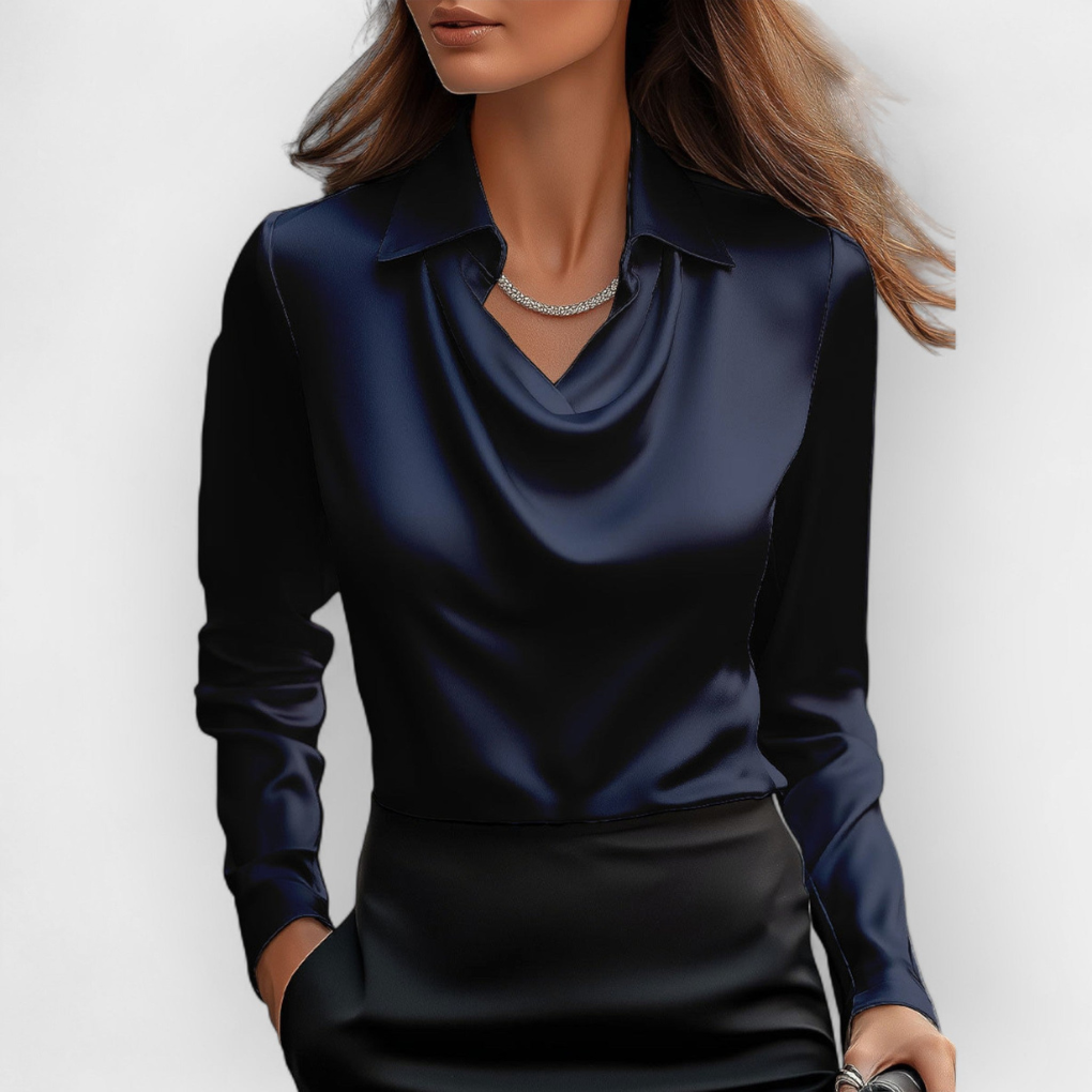 Allround kvinnebluse i glatt, glansfullt stoff med vannfallskrage. Elegant mote for kontor og festantrekk.