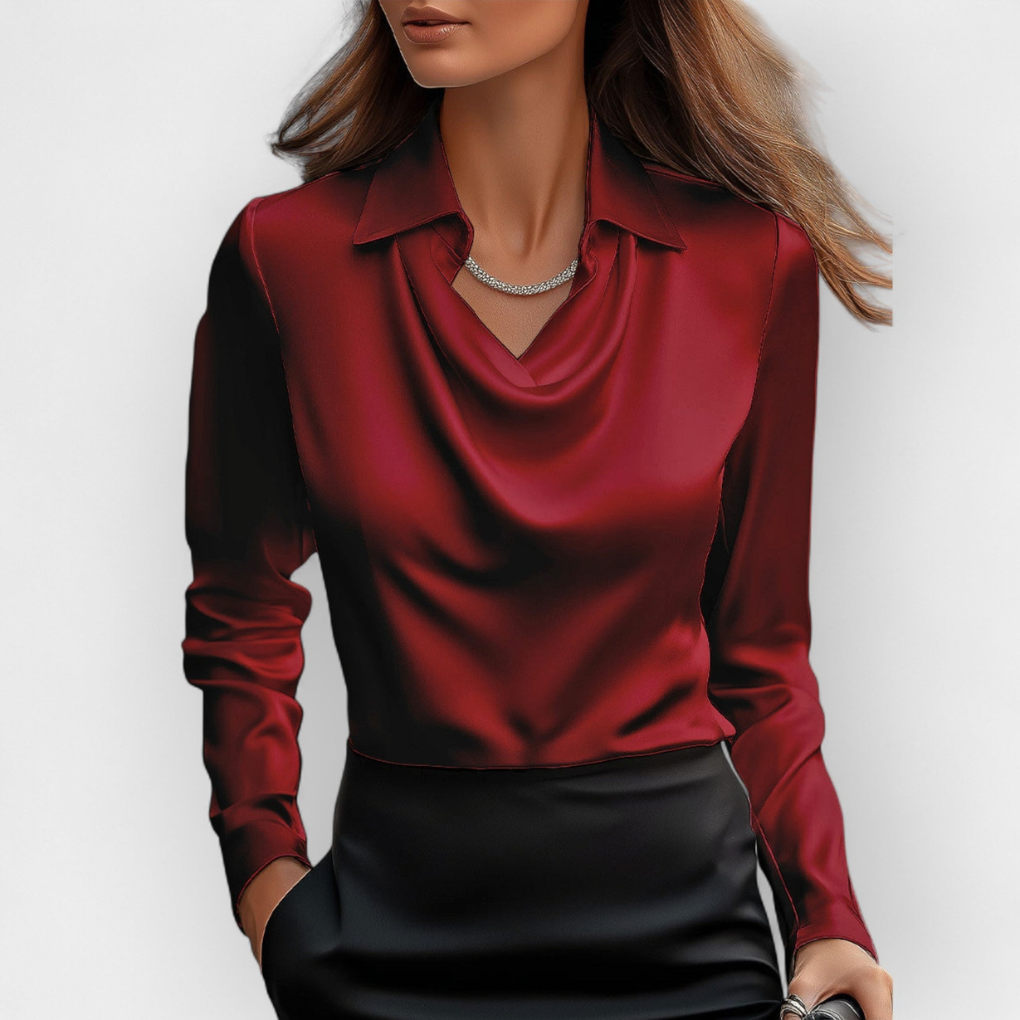 Glansfull glatt kvinnebluse med elegant vannfallskrage. Langermet, stilren for både fest og kontor.