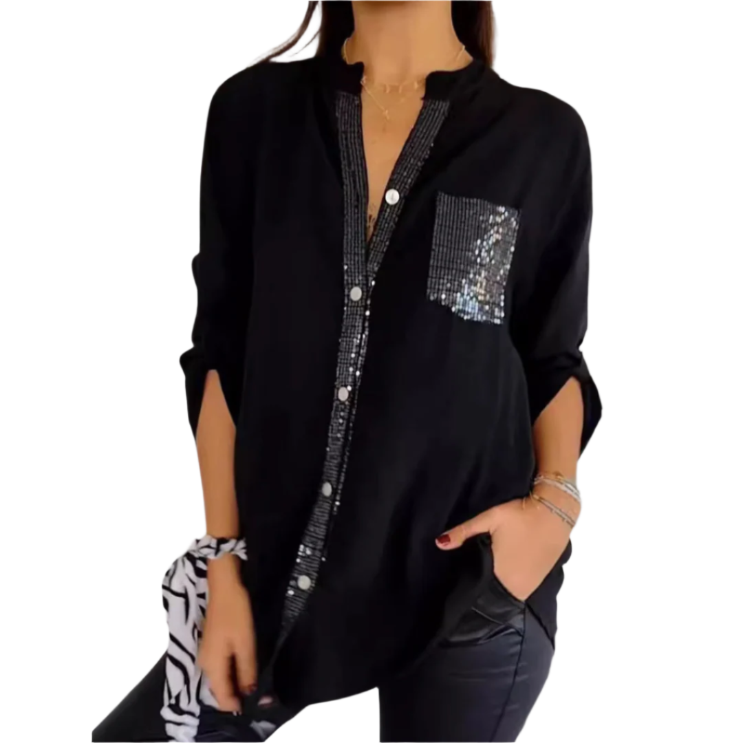 Elegant kvinnebluse med glitrende paljetter, perfekt for fest og selskaper. Komfortabel løs passform.