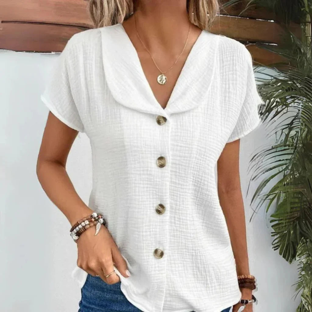 Elegant sommerbluse for kvinner. Feminin V-hals og stilige puffermer. Perfekt for vår- og sommermote.
