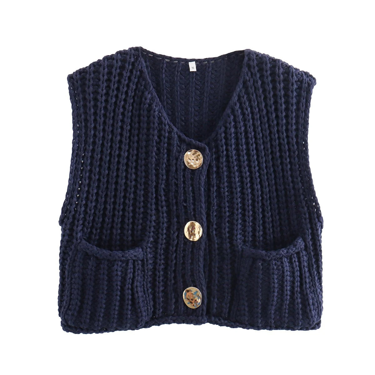 Elegant strikkevest for kvinner, perfekt for stil og komfort. Ermeløs vest med raffinerte metallknapper.