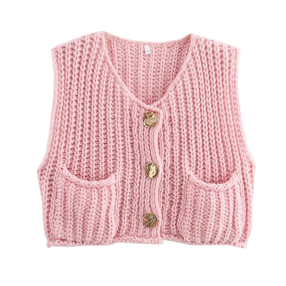 Tekstur av myk strikk på elegant strikkevest for kvinner. Detaljer av ermeløs damevest med metallknapper.