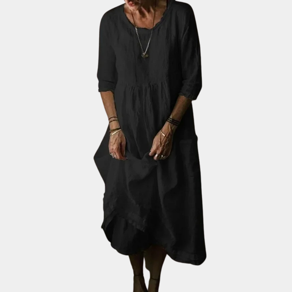 Kvinners midikjole med vintage preg, utstyrt med albuelange ermer for en tidløs og komfortabel look.