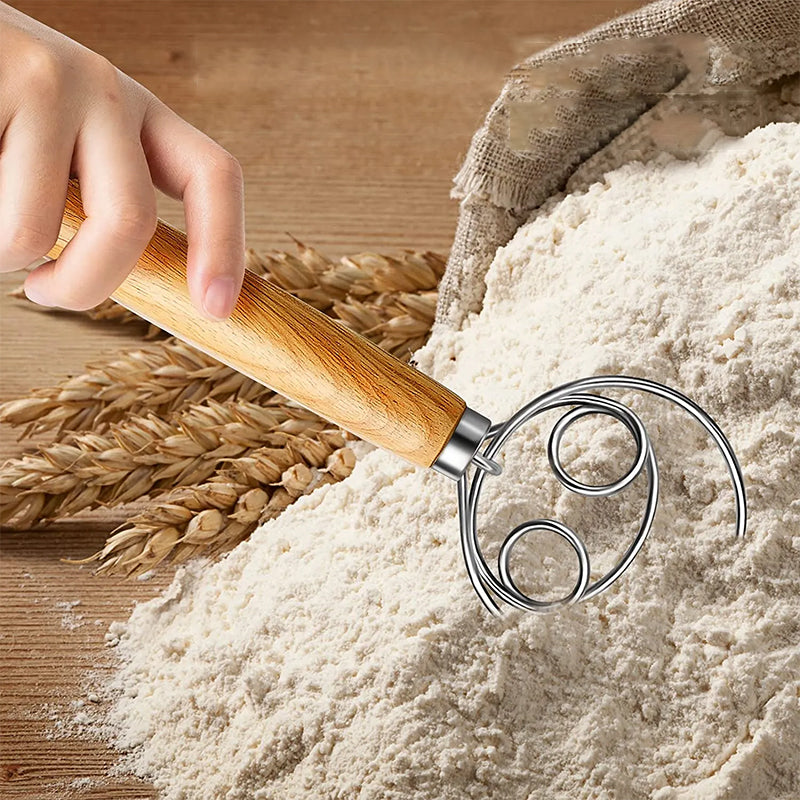 Nærbilde av trådene på deigvispen i rustfritt stål for optimal blanding.