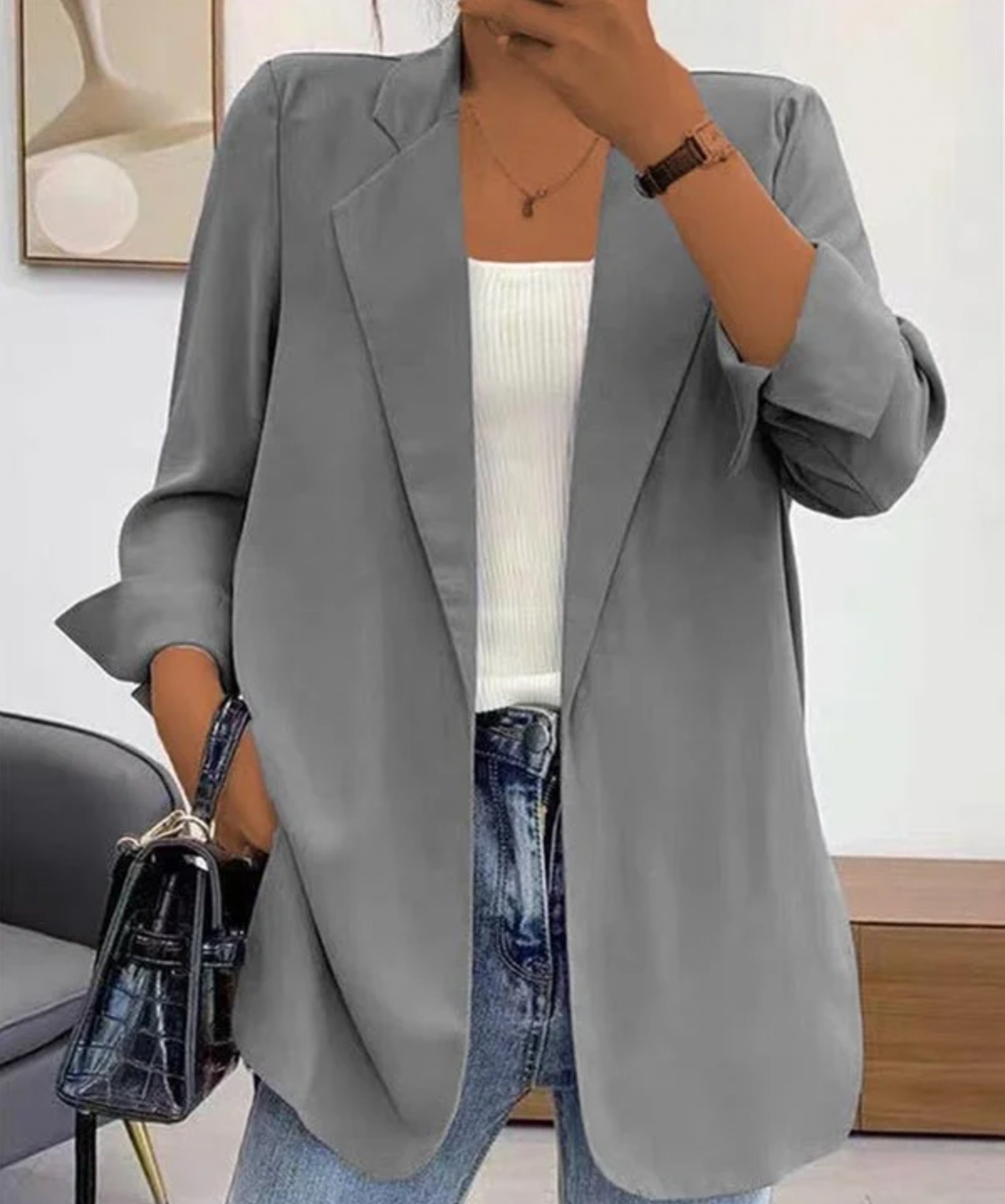 Elegant oransje dameblazer for en tidløs og formell stil. Perfekt yttertøy for vår og høst.