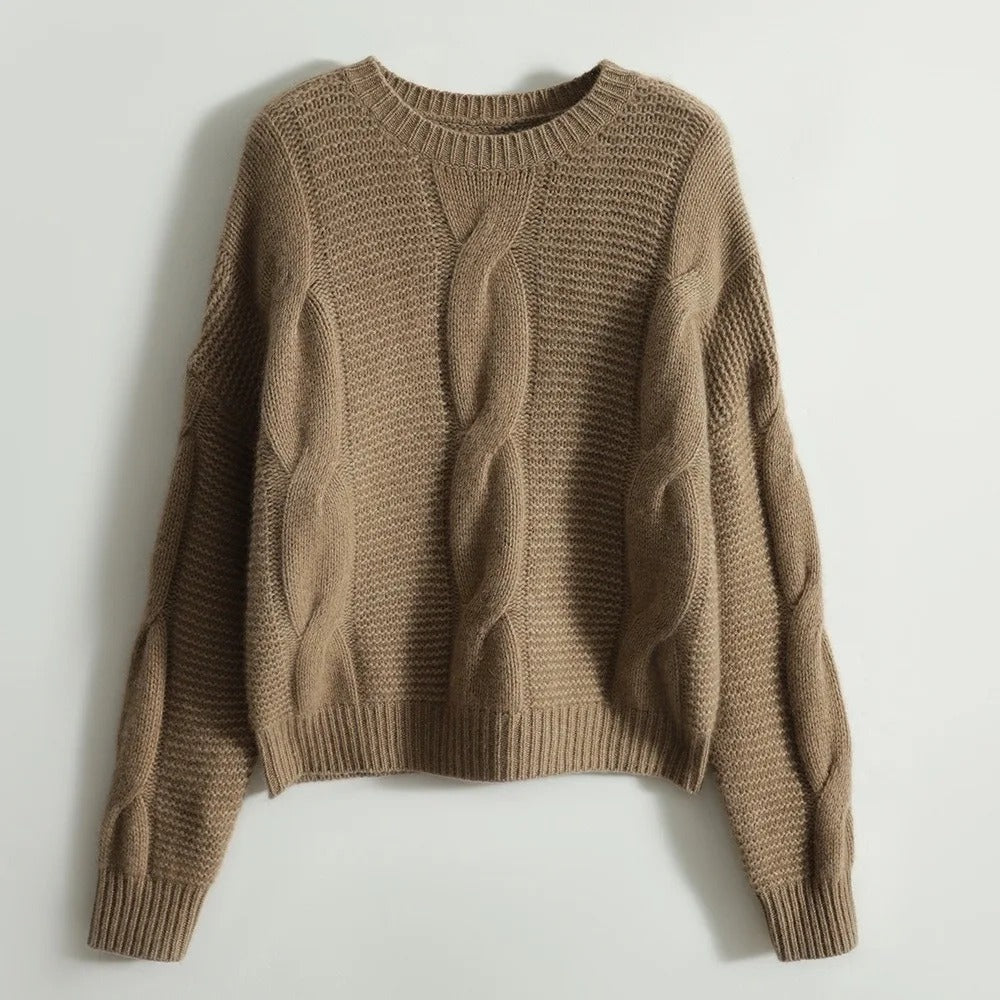 Stilren, komfortabel håndstrikket bomullsgenser med rundhals for dame. Perfekt for casual og varm bruk.