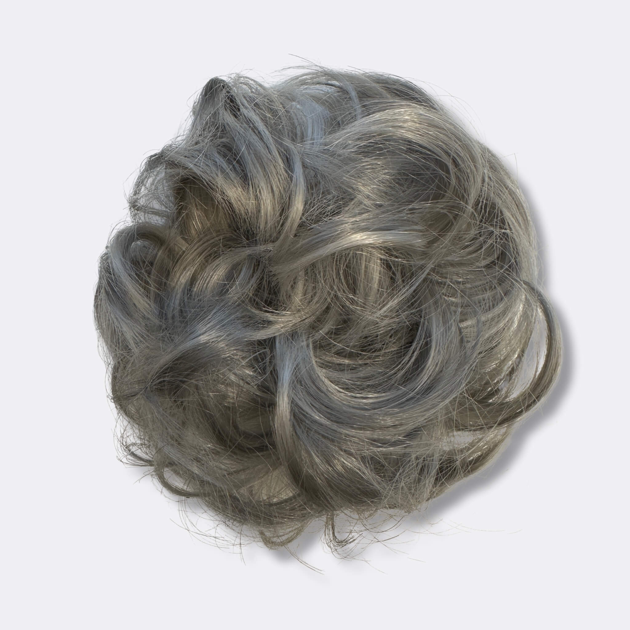 Hårtilbehør: Voluminøs scrunchie som gjør hårknollen fyldig og fin.