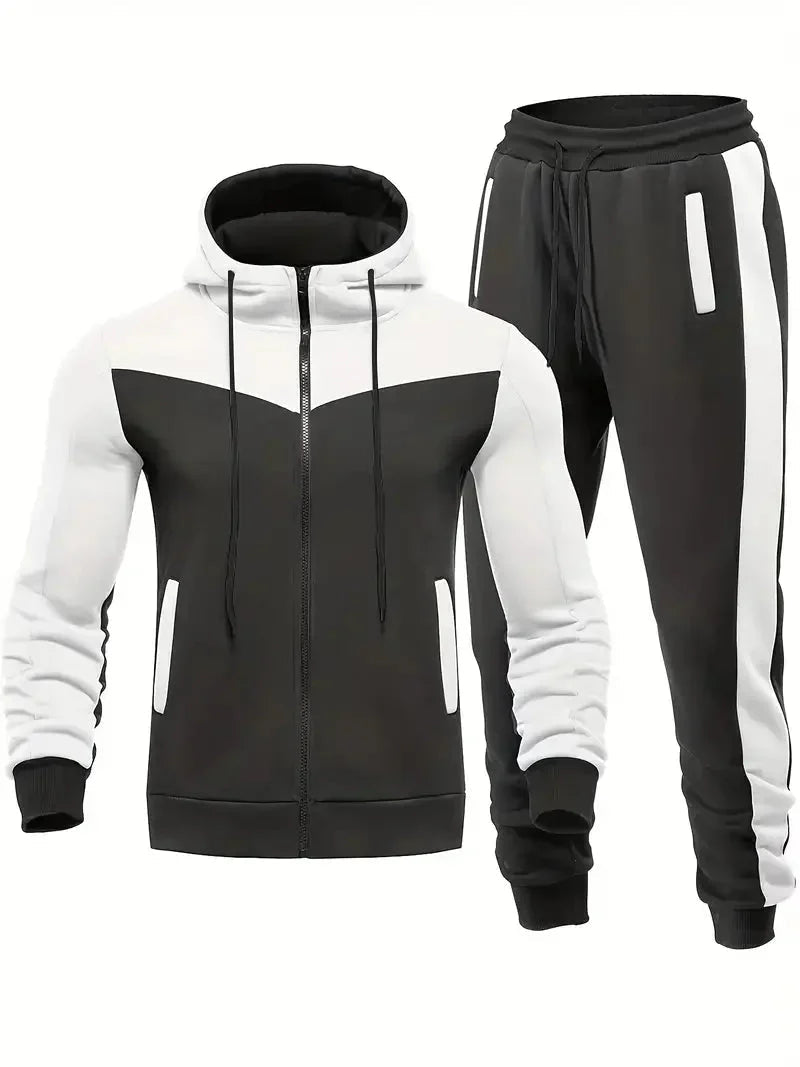 Mann jogger i moderne 2-delt treningsdress. Ideell for utendørs fitness og aktivt tøy.