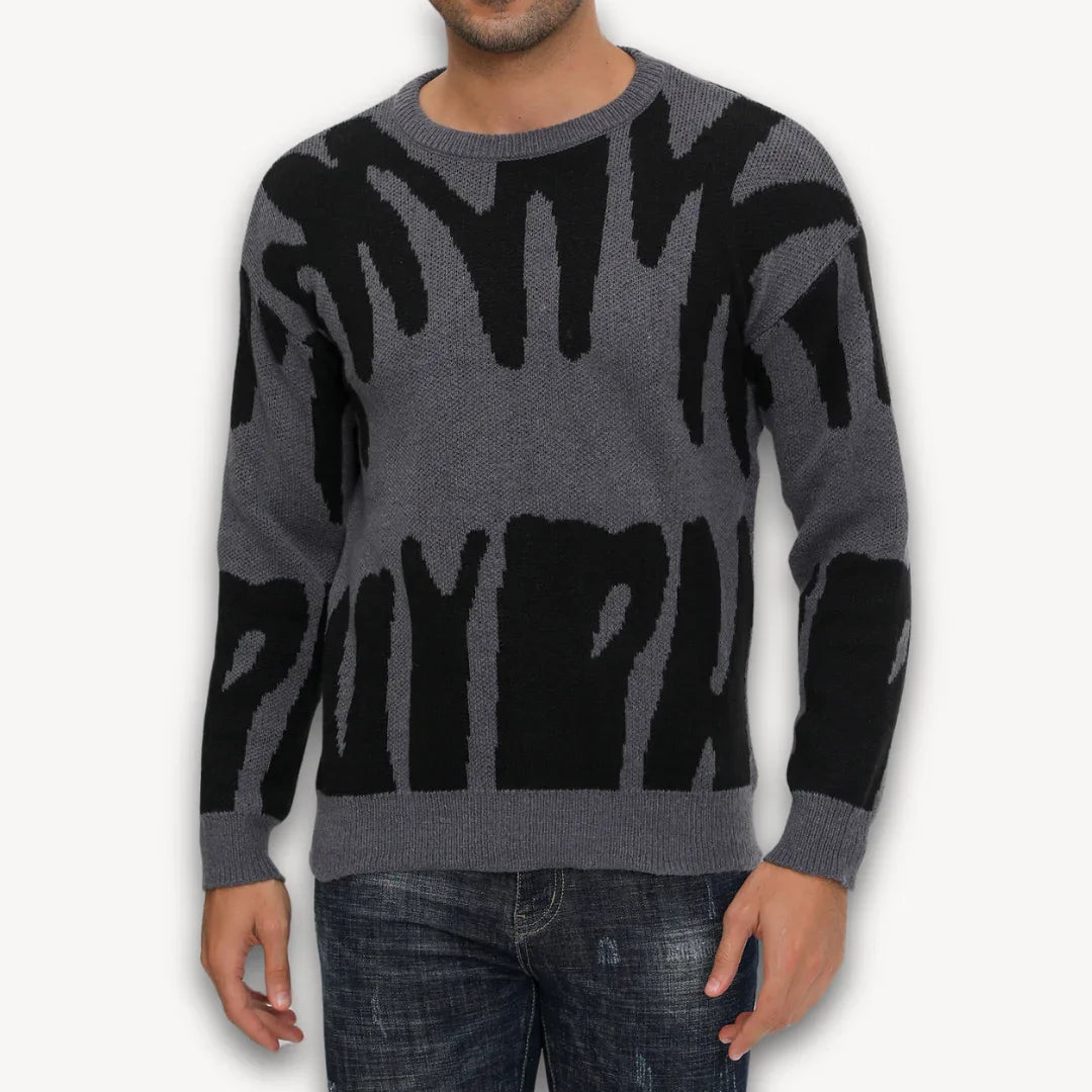 Stilig herre strikkegenser med moderne grafisk design, komfortabel og varm for vinterantrekk.