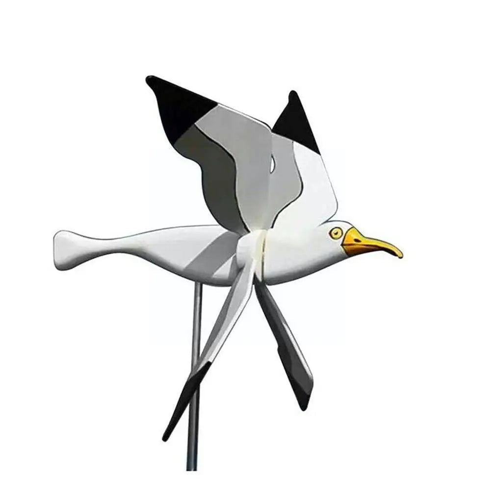 Kinetisk hageskulptur: elegant flygende fugl vindmølle i metall. Værbestandig hagedekorasjon for utendørs bruk.