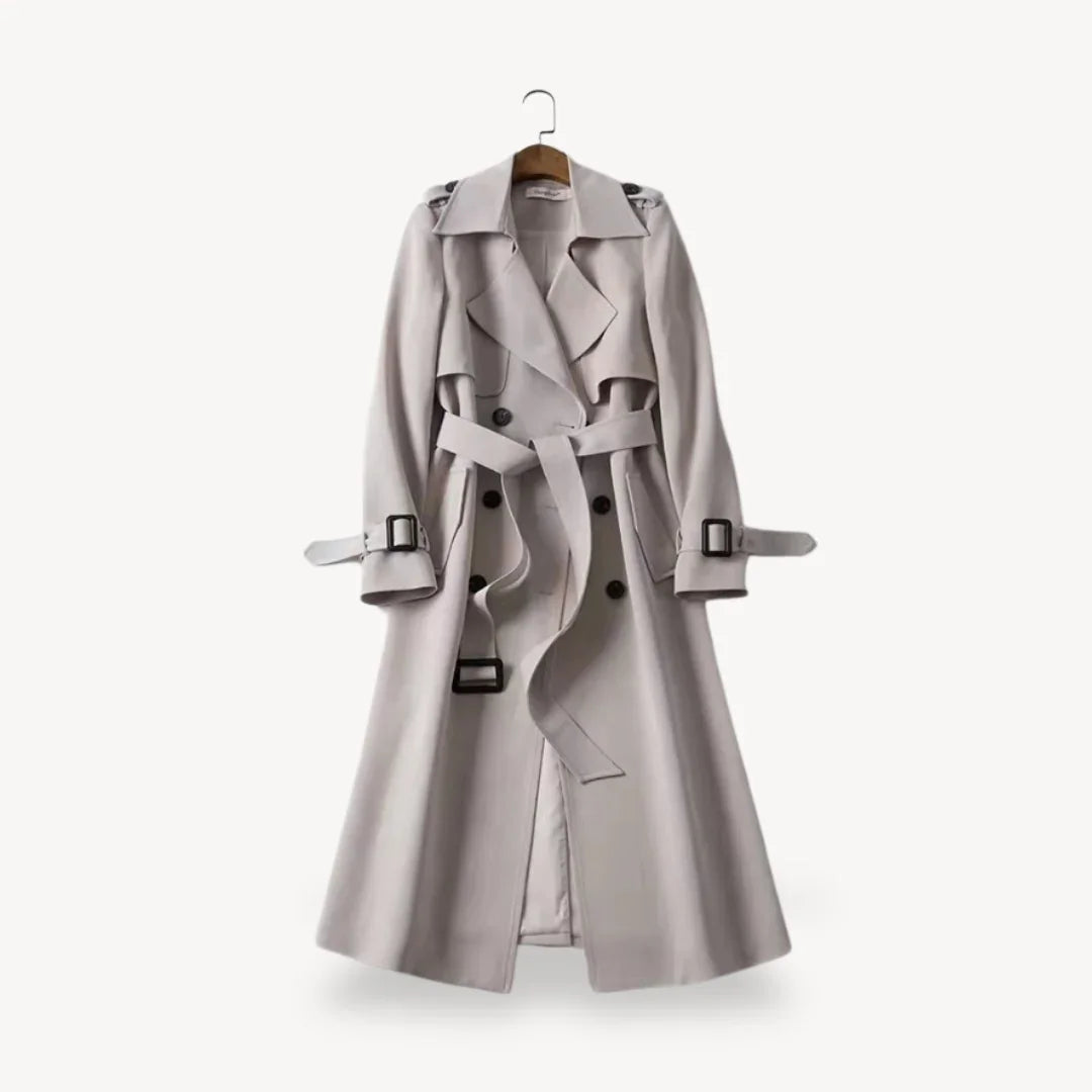 Tidløs trenchcoat damejakke i klassisk design, med justerbart belte for en flatterende silhuett.