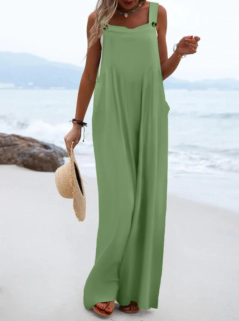 Komfortabel dame jumpsuit med bukseseler, vide ben, løs passform, ensfarget sommerdrakt.