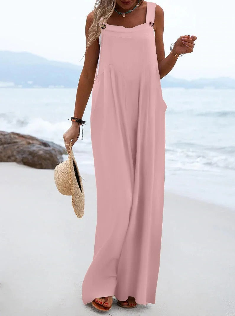 Komfortabel dame jumpsuit med bukseseler, vide ben, perfekt for stil og ferie i sommer.