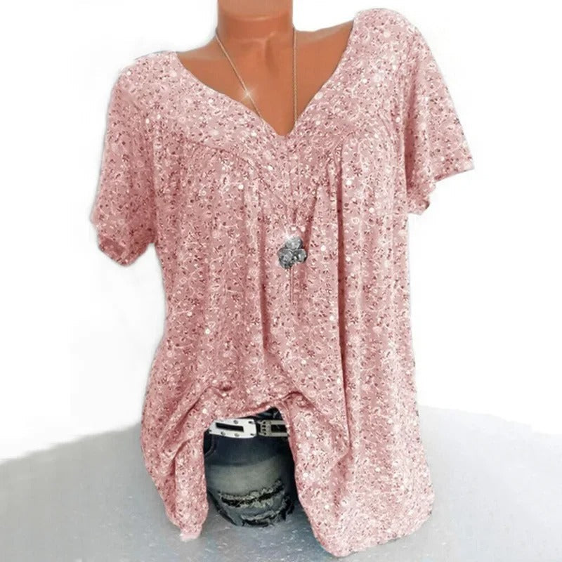 Fargerik blomstertrykk dame tanktopp med v-hals. Trendy og behagelig for sommerbruk.