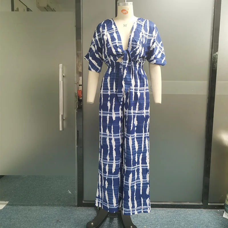 Casual blå dolman jumpsuit for kvinner med relaxed fit, v-hals og vide ben, komfortabel vårstil.
