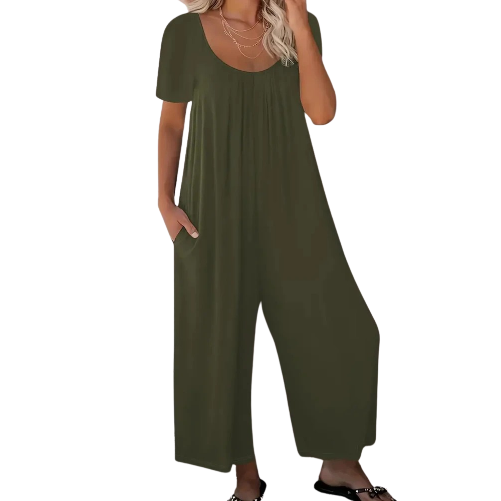 Kvinner i en lett og pustende ensfarget sommerjumpsuit, løs passform for maksimal komfort.