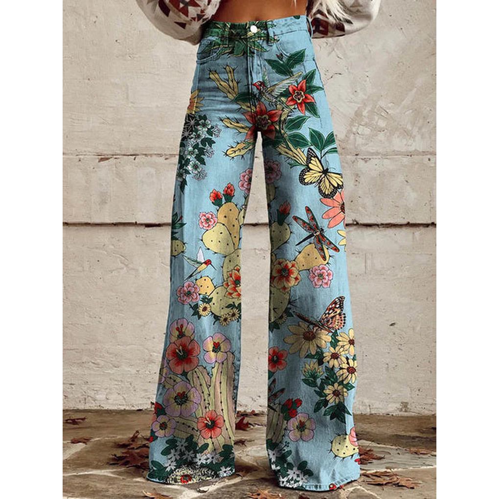 Lange fritidsbukser for damer med detaljert mønster av blomster. Laget av komfortabel polyester.